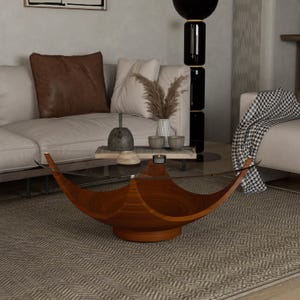 May include: A modern living room features a low, wooden coffee table with a unique, curved design. The table has a clear glass top. The room includes a beige sofa, decorative pillows, and a patterned rug.