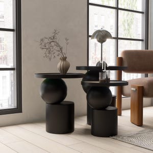 A handmade solid wood side table designed for modern and minimalist interiors. The natural wood surface shows subtle variations that highlight its unique character. Perfect for placing decor items, lighting, or everyday essentials. Ideal for living rooms, bedrooms, or office spaces, offering both functionality and a warm, refined aesthetic.