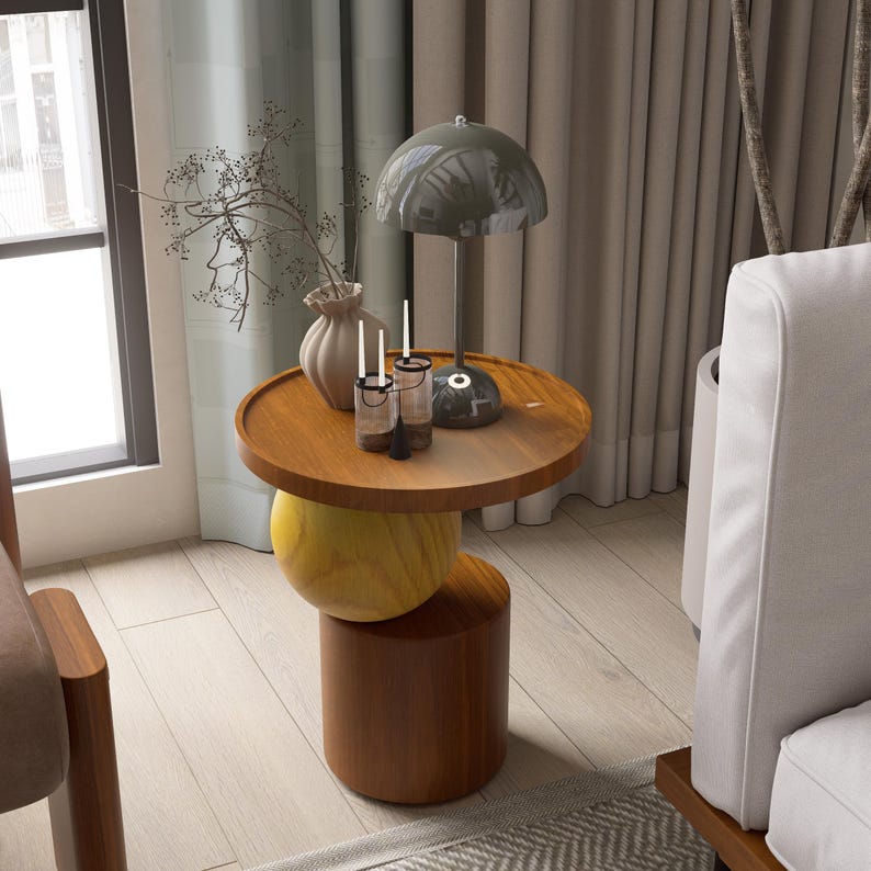 A handmade solid wood side table designed for modern and minimalist interiors. The natural wood surface shows subtle variations that highlight its unique character. Perfect for placing decor items, lighting, or everyday essentials. Ideal for living rooms, bedrooms, or office spaces, offering both functionality and a warm, refined aesthetic.