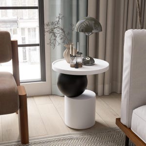 A handmade solid wood side table designed for modern and minimalist interiors. The natural wood surface shows subtle variations that highlight its unique character. Perfect for placing decor items, lighting, or everyday essentials. Ideal for living rooms, bedrooms, or office spaces, offering both functionality and a warm, refined aesthetic.