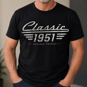 May include: Black t-shirt with the text "Classic 1951 - Limited Edition" in a silver, stylized font. The design includes the word "Classic" above the year "1951" with horizontal lines. A classic design for a birthday or anniversary.