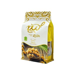 May include: A white and yellow stand-up pouch containing Leen Premium Dates. The packaging features gold Arabic calligraphy, the text Sukkari, and a graphic of dates in a woven basket on a wooden surface with a green palm frond.