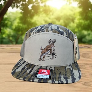 Deer Hunting 7 Panel Hat | Fence Jump Embroidery Design | Bottomland Camo Flat Bill Trucker Cap | Hunting Mesh Snapback