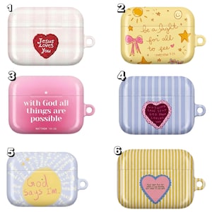 May include: A collection of six AirPod cases with various designs. The cases feature different colors and patterns, including stripes, plaid, and illustrations. Each case has a unique design with inspirational quotes and religious themes. The cases are designed to protect and personalize AirPods.