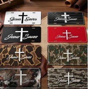 May include: Collection of license plates with the text "Jesus Saves" and a cross design. Plates come in various colors and patterns, including black, red, camouflage, and a design resembling the American flag.