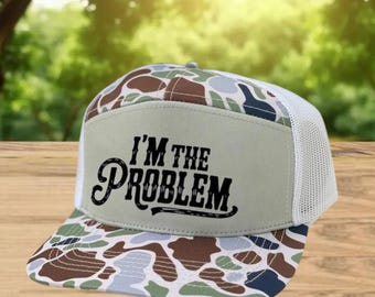 I Am The Problem Printed Camo Trucker Hat | Funny Quote Snapback Mesh Cap