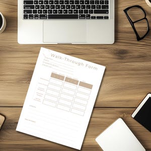 May include: A wooden desk with a laptop, a cup of coffee, and a "Walk-Through Form" document. The form has a grid for observations. Other items include a notepad, glasses, a tablet, and a small plant.