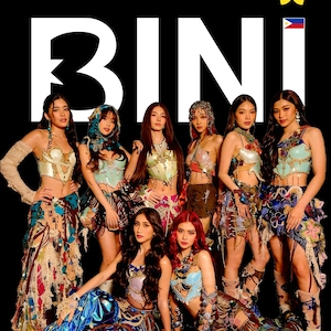 May include: Group of eight women in colorful, ornate outfits posing against a black background. The word "BINI" is displayed in large white letters. A yellow star and the Philippine flag are in the upper right corner. The women are wearing tops and bottoms with intricate designs.