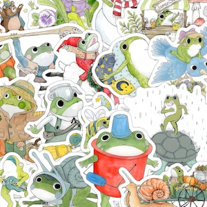 Op de afbeelding: Een verzameling grillige kikkerstickers in verschillende poses en outfits. De stickers tonen kikkers gekleed in hoeden, jassen en met voorwerpen zoals bezems en emmers. Het kleurenpalet omvat groen, blauw en bruin, met een cartoonachtige illustratiestijl.