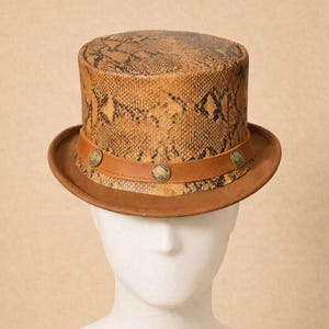 May include: A white ceramic mug with a black handle and the text "But First, Coffee" in a handwritten style. The mug is on a white surface. The mug is approximately 4 inches tall.