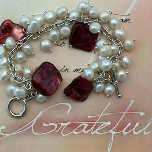 May include: A handmade wooden sign with the text "Welcome to our home" in a handwritten style. The sign is painted white with black lettering and a distressed finish, perfect for home decor.