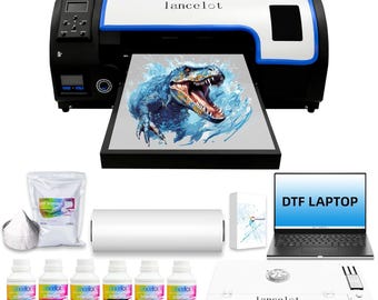 May include: A Lancelot DTF printer with a black and white casing, printing a blue dinosaur graphic. Includes a laptop labeled DTF LAPTOP, a white powder bag, a roll of film, six ink bottles in cyan, magenta, yellow, black, and white, and a curing oven.