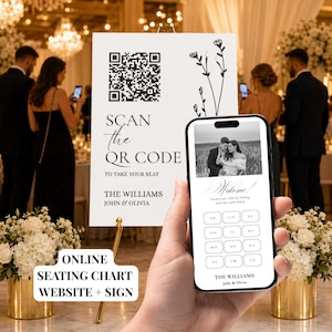 以下が含まれることがあります： 黒いQRコード、花の線画、および「SCAN THE QR CODE TO TAKE YOUR SEAT THE WILLIAMS JOHN & OLIVIA」というテキストが記載された白い結婚式の座席表サイン。スマートフォンには、カップルの写真が入った一致するデジタル座席表が表示されています。