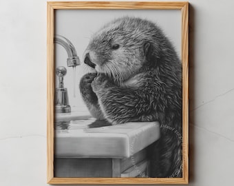 May include: A framed black and white print of an otter washing its face under a faucet. The print is in a light brown wooden frame. The text "PIXEL TO PRINT" is at the top of the image.