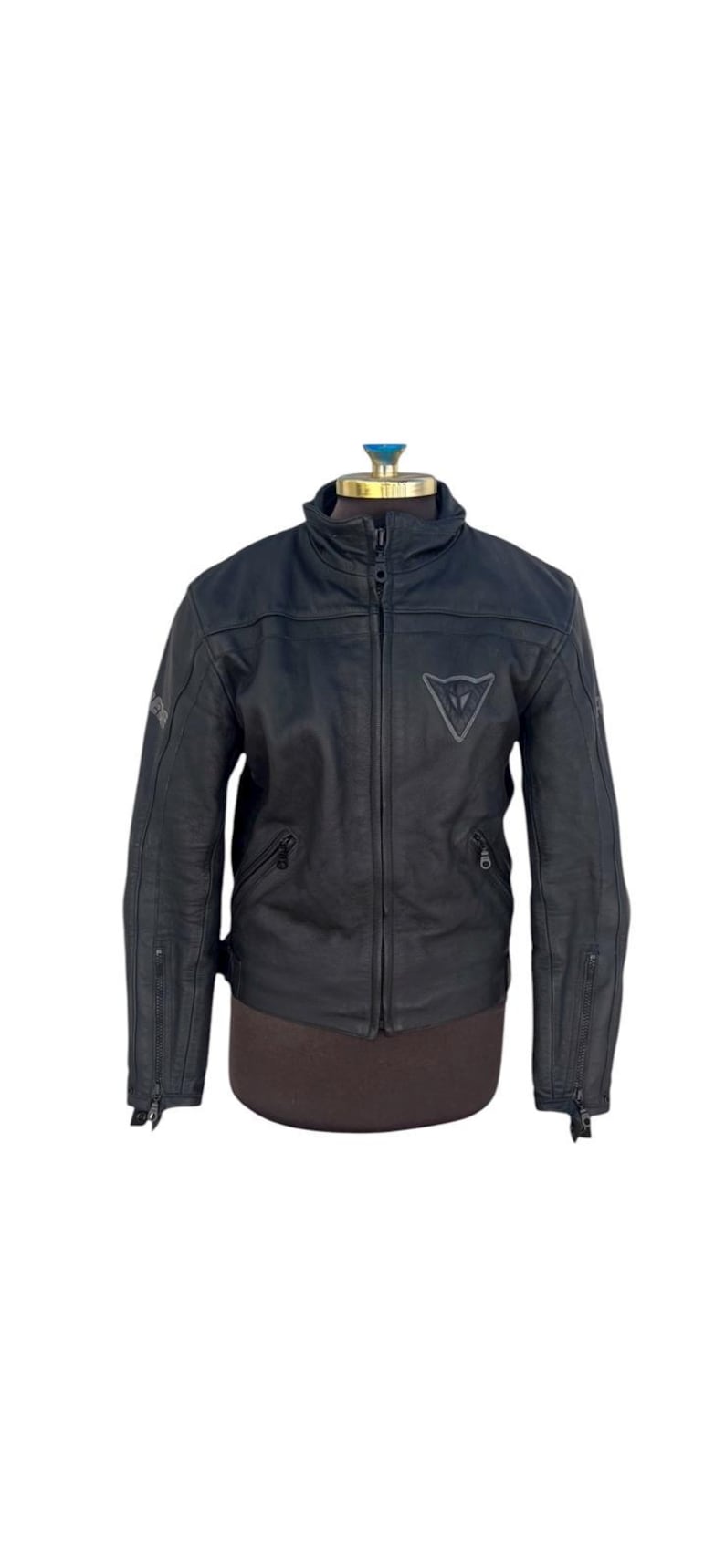 May include: A white ceramic mug with a black handle and the text "But First, Coffee" in a handwritten style. The mug is on a white surface. The mug is approximately 4 inches tall.