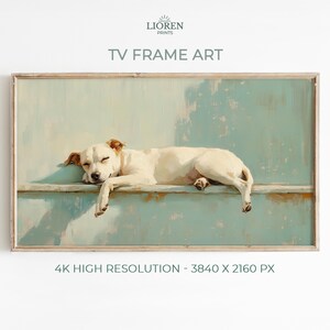 May include: A framed print titled "TV Frame Art" featuring a sleeping white dog with brown ears. The dog is resting on a light blue surface. The artwork is labeled as 4K high resolution.
