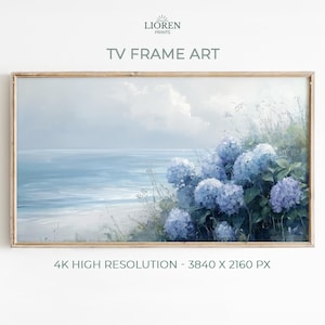 May include: A framed landscape painting depicting a coastal scene with a light blue ocean, sky, and beach. The artwork includes blue hydrangea flowers and the text "TV FRAME ART" and "4K HIGH RESOLUTION - 3840 X 2160 PX".