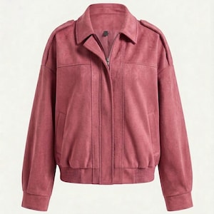 May include: A dusty rose bomber jacket featuring a collared neckline, a full-length front zipper closure, and long sleeves with ribbed cuffs. The jacket includes vertical seam detailing on the front, shoulder epaulets, and a ribbed hemline.