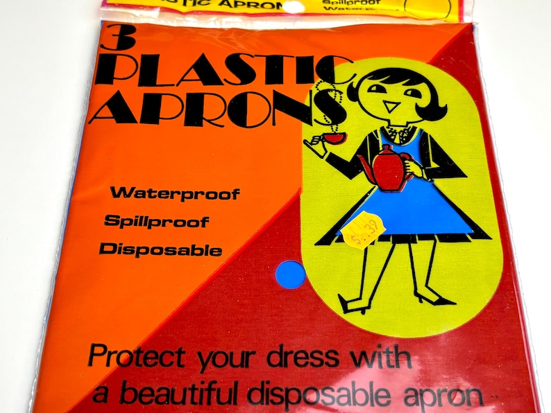 May include: A package of three plastic aprons. The packaging is orange and red with the words "3 PLASTIC APRONS" in large black letters. The aprons are waterproof, spillproof, and disposable. The package features a cartoon illustration of a woman in a blue dress.