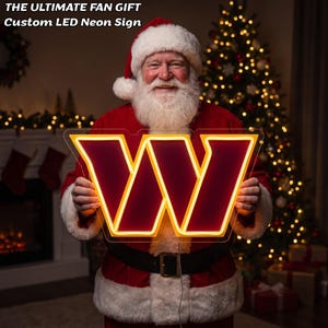 May include: A custom LED neon sign shaped like the letter W, featuring a deep burgundy centre with a bright yellow border. The sign displays the text THE ULTIMATE FAN GIFT Custom LED Neon Sign at the top, illuminated in a festive holiday setting.