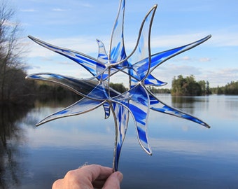 Stained Glass suncatcher, window  hanging Star in blue and white streaky on clear glass. 12 inches in diameter.