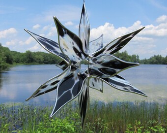 Stained glass suncatcher, window hanging Star sculpture in black and white streaky glass. 11.5 inches in diameter