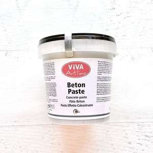 May include: A white plastic tub with a black lid and a red and white label. The label says "Viva Artline Beton Paste" and "Concrete paste, Pate Beton, Pasta Effetto Calcestruzzo".