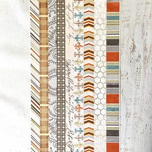 May include: A sheet of Swagger tape stickers with various patterned designs. The designs include stripes, paisley, fleur-de-lis, and chevron patterns in brown, orange, gray, and teal colors. The sheet has the text "Swagger Tape Stickers" and item number 1897.