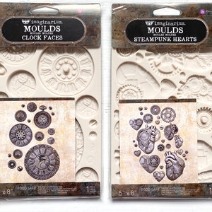May include: Two silicone moulds for baking, one with clock faces and the other with steampunk hearts. Both moulds are 5 inches by 8 inches and are food safe.