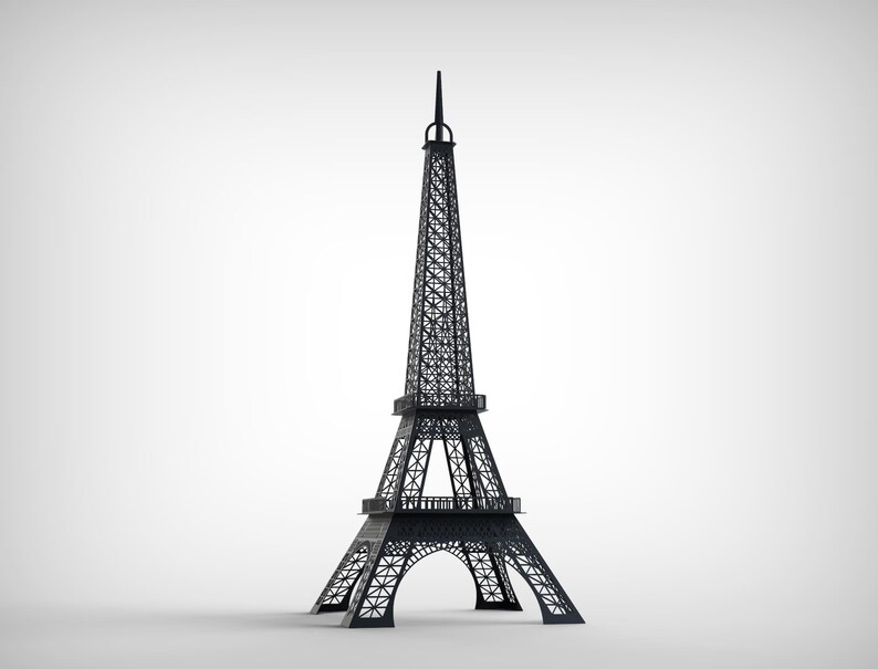 Pode incluir: Um modelo preto da Torre Eiffel, um famoso marco em Paris, Fran&ccedil;a. A torre tem um design de treli&ccedil;a detalhado e um topo pontiagudo. O modelo &eacute; um item decorativo, em p&eacute; sobre uma superf&iacute;cie branca.