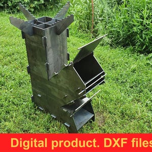 May include: A metal rocket stove with a rectangular body and angled side panels, set on a grassy lawn. The stove has a chimney-like top and several openings. The text "Digital product. DXF files." is displayed on a red banner.