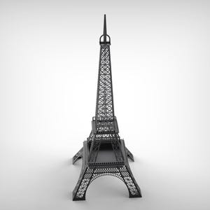 Pode incluir: Um modelo preto da Torre Eiffel, uma r&eacute;plica em miniatura do ic&oacute;nico monumento parisiense. A intrincada estrutura de treli&ccedil;a da torre &eacute; vis&iacute;vel, com arcos detalhados na base e uma agulha no topo. O modelo est&aacute; sobre um fundo branco.