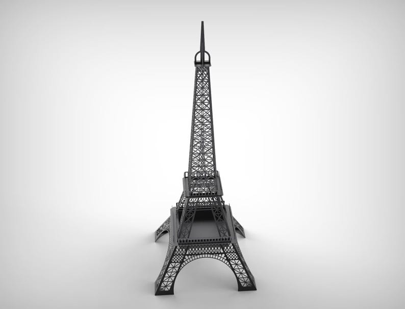 Pode incluir: Um modelo preto da Torre Eiffel, uma r&eacute;plica em miniatura do ic&oacute;nico monumento parisiense. A intrincada estrutura de treli&ccedil;a da torre &eacute; vis&iacute;vel, com arcos detalhados na base e uma agulha no topo. O modelo est&aacute; sobre um fundo branco.