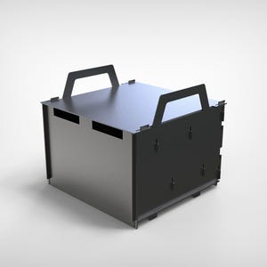 May include: A dark gray metal box with two rectangular handles on top. The box has a rectangular shape with a flat top and sides. The box has a modern, industrial design.