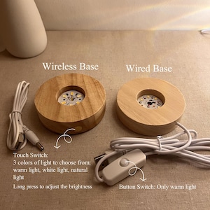 May include: Two wooden LED light bases, one wireless and one wired, labelled "Wireless Base" and "Wired Base". The wireless base has a touch switch with three light colour options. The wired base has a button switch for warm light.