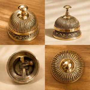 Peut inclure: Une cloche de bureau en laiton poli avec un sommet bomb&eacute; &agrave; cannelures verticales et une base orn&eacute;e d'un motif de volutes en relief. La cloche comprend un m&eacute;canisme &agrave; bouton-poussoir central et un battant interne visible par le dessous.