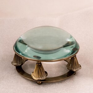 May include: A set of three ceramic nesting bowls in shades of blue, green, and white. The bowls feature a speckled glaze and a simple, modern design. The largest bowl measures approximately 6 inches in diameter.