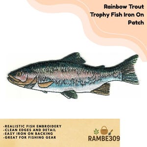 May include: Embroidered rainbow trout iron-on patch. The patch features a detailed design of a rainbow trout with realistic fish embroidery. The patch has clean edges and is easy to iron on. The text "Rainbow Trout Trophy Fish Iron On Patch" is at the top.
