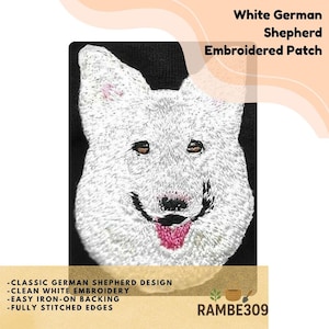 May include: White German Shepherd embroidered patch. The patch features a detailed, smiling white German Shepherd dog face with pink accents on a black background. The text "White German Shepherd Embroidered Patch" is at the top. Additional text includes "Classic German Shepherd Design".