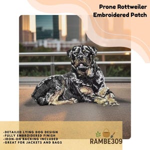 May include: Embroidered patch featuring a detailed prone Rottweiler design. The patch has a fully embroidered finish and iron-on backing. The text "Prone Rottweiler Embroidered Patch" is at the top. Additional text includes "-DETAILED LYING DOG DESIGN -FULLY EMBROIDERED FINISH -IRON-ON BACKING INCLUDED -GREAT FOR JACKETS AND BAGS".