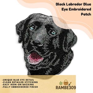 May include: Embroidered patch featuring a black Labrador with blue eyes. The patch has detailed stitching and an iron-on backing. Text on the patch reads "Black Labrador Blue Eye Embroidered Patch". Additional text includes "UNIQUE BLUE EYE DETAIL", "CLEAN DETAILED STITCHING", "EASY IRON-ON BACKING", and "FULLY EMBROIDERED FINISH".
