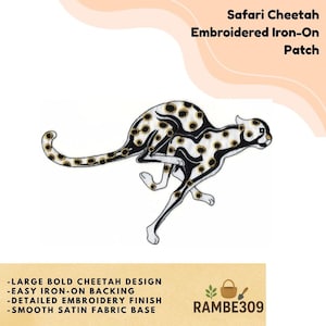 May include: Embroidered iron-on patch featuring a running cheetah with black spots and gold accents. The patch has a smooth satin fabric base and includes the text "Safari Cheetah Embroidered Iron-On Patch".