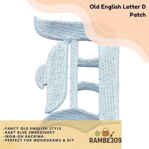 May include: Baby blue embroidered iron-on patch of the Old English letter "D". The patch features a fancy, stylized design. The text "Old English Letter D Patch" is displayed at the top. The text "RAMBE309" is at the bottom.