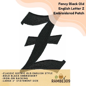 May include: A black embroidered patch featuring the letter "Z" in a classic gothic old English style. The patch is 3 inches in size and has iron-on backing. The text "Fancy Black Old English Letter Z Embroidered Patch" is at the top.