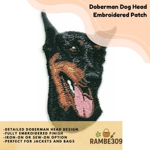 May include: Embroidered patch featuring a detailed Doberman dog head with its tongue out. The patch is black, brown, and pink, with the text "Doberman Dog Head Embroidered Patch". It has an iron-on or sew-on option.