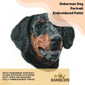 May include: Embroidered patch featuring a Doberman dog portrait. The patch has a detailed design with black, brown, and tan colors. The text on the patch reads "Doberman Dog Portrait Embroidered Patch". Additional text includes "-BOLD DOBERMAN PORTRAIT -CLEAN DETAILED STITCHING -EASY IRON-ON BACKING -FULLY EMBROIDERED FINISH".