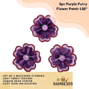 May include: Three purple furry flower patches, each 1.25 inches in diameter, with a sequin bead center and easy iron-on backing. The flowers have a soft, furry texture and a dark purple color with a lighter purple and burgundy trim. The text says "3pc Purple Furry Flower Patch 1.25".