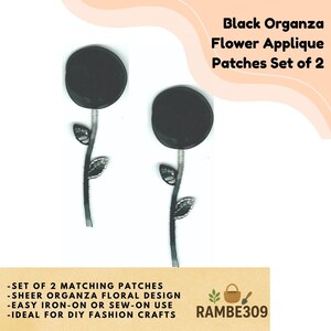 May include: Two black organza flower applique patches. Each patch features a circular flower head atop a slender stem with leaves. The text "Black Organza Flower Applique Patches Set of 2" is visible.