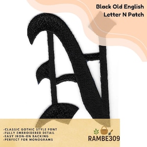 May include: Black Old English letter "N" patch. The patch features a classic gothic style font with fully embroidered detail. The patch is designed for easy iron-on application. The text "Black Old English Letter N Patch" is displayed at the top.