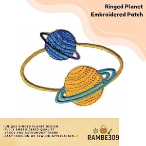 May include: Embroidered patch featuring two planets with rings, one blue and one gold, connected by a gold embroidered line. The patch has the text "Ringed Planet Embroidered Patch". Additional text includes "Unique Ringed Planet Design" and "Space and Astronomy Theme".